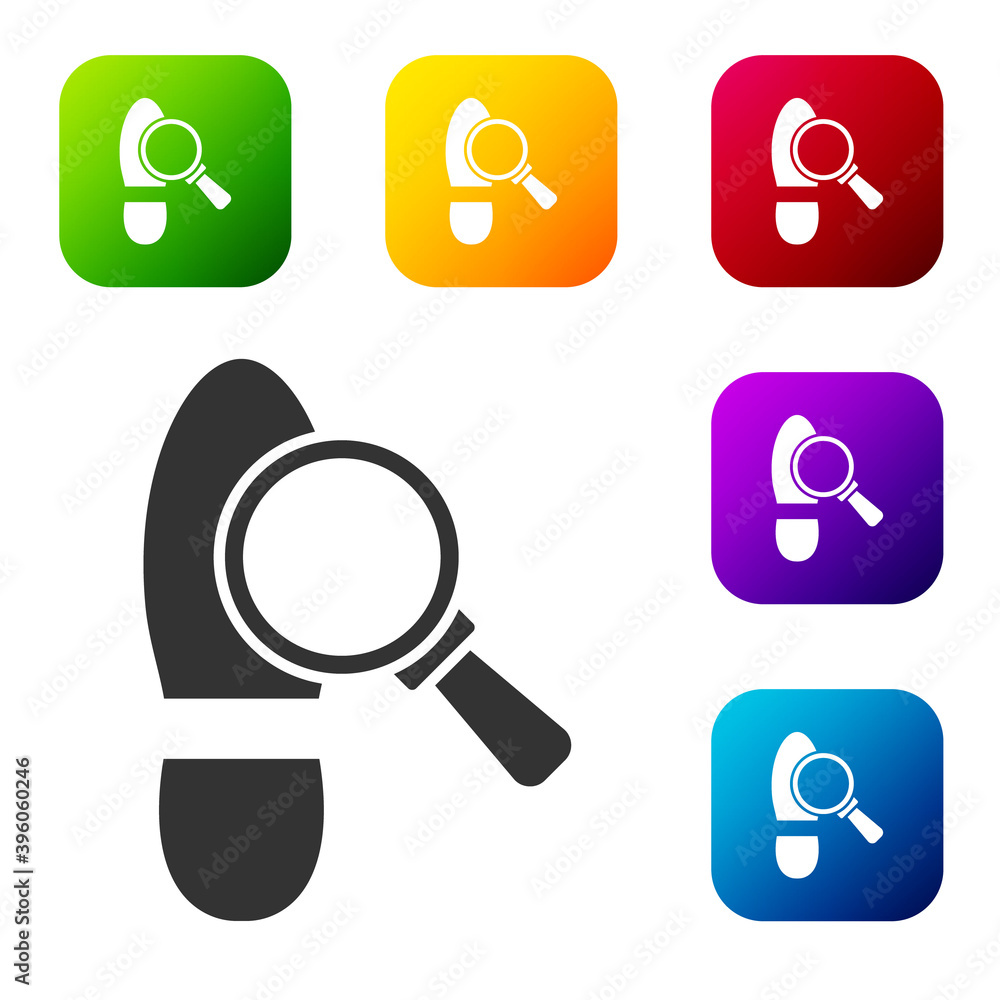 Aufkleber black magnifying glass with footsteps icon isolated on white background. detective is investigating.