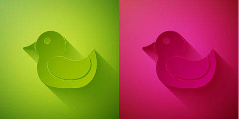 Paper cut Rubber duck icon isolated on green and pink background. Paper art style. Vector.