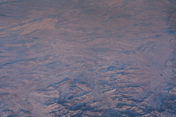 Aerial view of  Inner Mongolia Autonomous Region though an window form an airplane on a sunny day