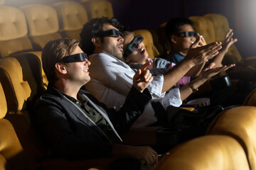 3D Movie. Group of diversity people in theater with popcorn and drinks.