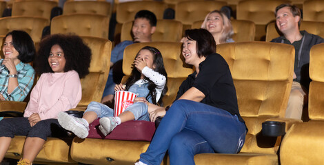 Happy family watching movie in cinema theatre. Happy family time in holiday