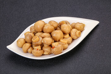 Pickled champignons in the bowl