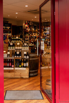 Open Door To A Liquor Store With A Wide Range Of Wines. Entrance. Vertical. Paris, Russia, 10-09-2019.