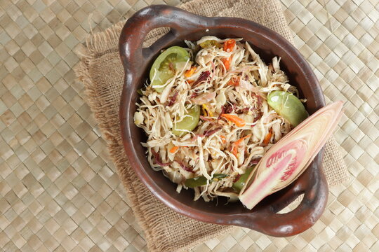 Ayam suir Kecombrang : shredded chicken spicy with kecombrang or honje or kincung fragrant edible flower. Selective focus