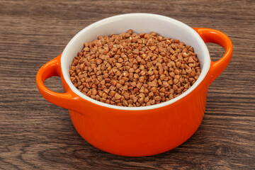Raw buсkwheat cereal in the bowl