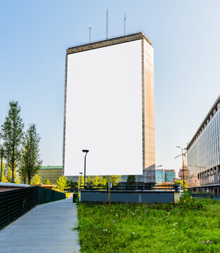 Blank billboard on building for outdoor advertising in Milano, Italy.