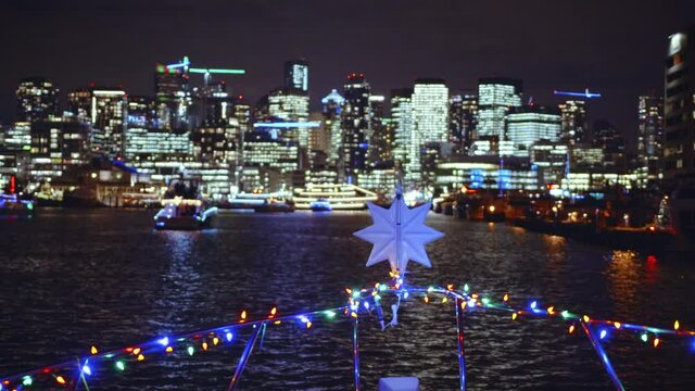 Christmas Star Light Decoration on Boat Front with Seattle City Background