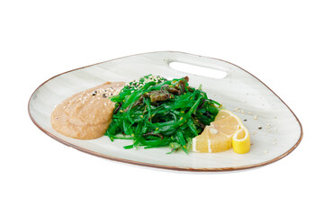 Hiyashi wakame chuka salad with nut sauce isolated on white