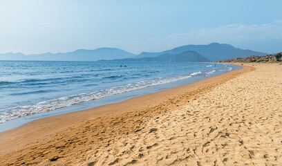 Popular resort Iztuzu beach with fine yellow sand awaits vacationers and tourists in Turkey, near Dalyan. Sea paradise and relaxation concept. This place is famous by Loggerhead turtle nesting spot