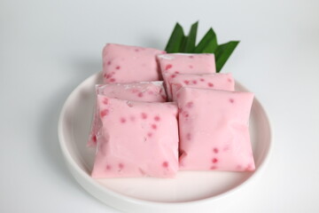 Cantik Manis. Indonesian traditional steamed dessert made from mung bean flour, sago pearls and coconut milk