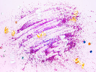 Abstract minimalist shiny pink background. Pink sequins are scattered on a pink background. New year or Christmas concept. Greeting card