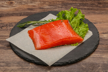 Salmon piece steak served rosemary