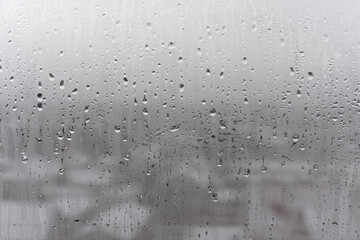 Dripping Condensation, Water Drops Background Rain drop Condensation Texture. Close up for misted glass with droplets of water draining down