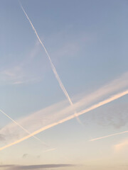 Fototapeta na wymiar Geometric traces of an airplane in the sky