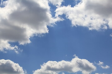 Beautiful background created from blue sky in the center and clouds around the edges