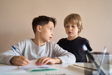 Brothers learning at home, Homeschooling. High quality photo