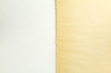 Torn brown beige piece of cardboard and white sheet of paper texture background. Two parts of vintage paper. Copy space for text.