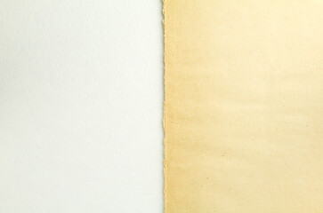 Torn brown beige piece of cardboard and white sheet of paper texture background. Two parts of vintage paper. Copy space for text.