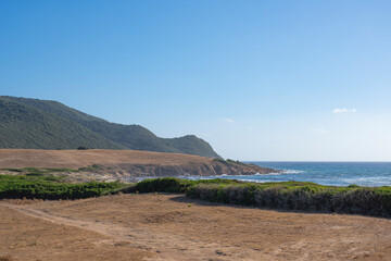 view of a surfer beach in Corsica, the best place for sunset photos of the bloodthirsty islands, landscapes and panoramas unique in the world