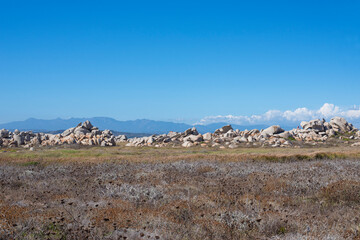 View of many large magnificent rocks of the Lavezzi islands in southern Corsica after Bonifacio, a short tour by tourist boat to arrive on the beach with turquoise water