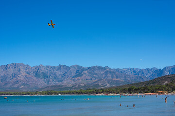 bomber plane on the beach of calvi for the fire in the mountains