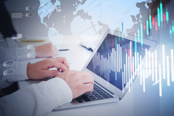 Man with laptop, map and graph