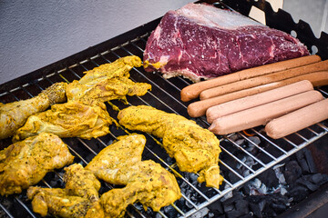 Assorted delicious grilled meat over the coals on barbecue