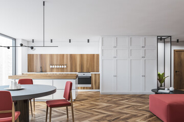 White and wooden kitchen with table