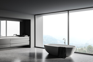 Fototapeta premium Gray and wooden bathroom corner with tub and sink