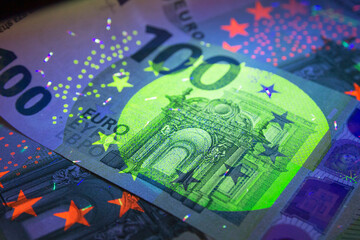 Euro currency in UV light protection.Euro in UV light.Euro currency in UV light protection.