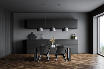 Gray kitchen with dining table