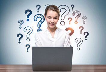 Woman with laptop and question marks