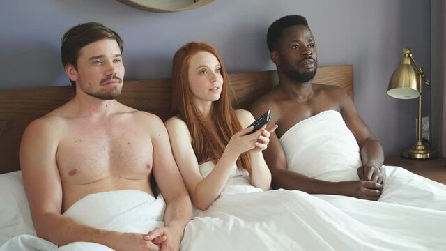 interracial couple having complicated affair and love triangle in bedroom.
