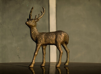 Deer- decoration element. Golden color.