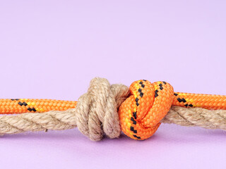 Double Fisherman’s Bend on a pastel purple background.