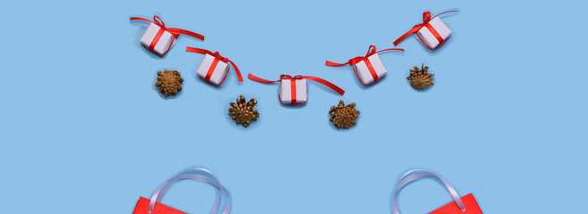  Flatlay Christmas sales and fairs. Paper bags for shopping and gift wrappers, alternating with...