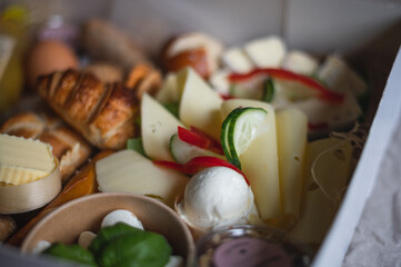 cheese lies on a variation for breakfast served in a box to have vegetarian breakfast at home