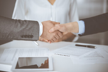 Business people shaking hands finishing contract signing, close-up. Business communication concept. Handshake and marketing