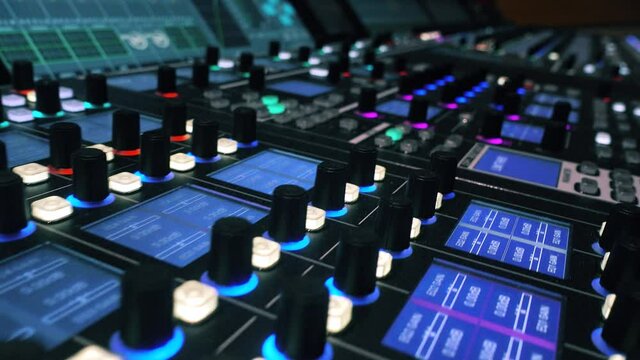 Digital audio production console. Mixing Board. Recording studios. Video contains small noise.