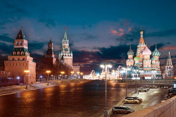 Fototapeta premium Red Square in Moscow. Sights of Moscow. St. Basil's Cathedral near Kremlin. Moscow in the winter evening. Snow on the red square. Winter in Russian Federation. Pnorama of Russia at night.