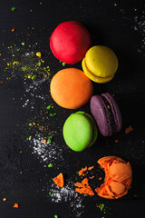 Macaroon cake on dark background top view.