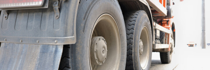 Truck is standing on roadway rear wheels closeup. Rent of trucks concept
