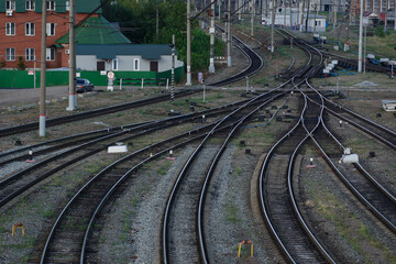 Fototapeta na wymiar Converging rails on the railway station