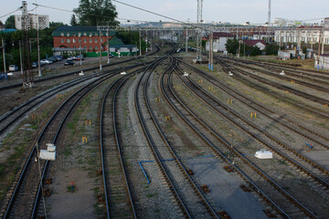 Obraz premium Converging rails on the railway station