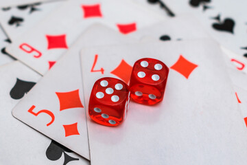The dice are laid on top of the cards with a winning combination