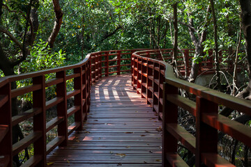 Wooden footpaths in the mangrove forest at Stupa in the middle of river in Rayong.