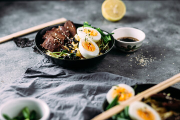 Japanese ramen soup on dark background