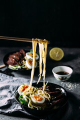 Japanese ramen soup on dark background