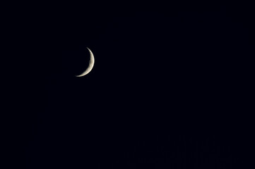 Crescent moon on a dark blue skye