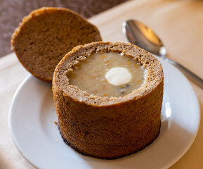aromatic traditional hot chowder in a bowl of rye bread